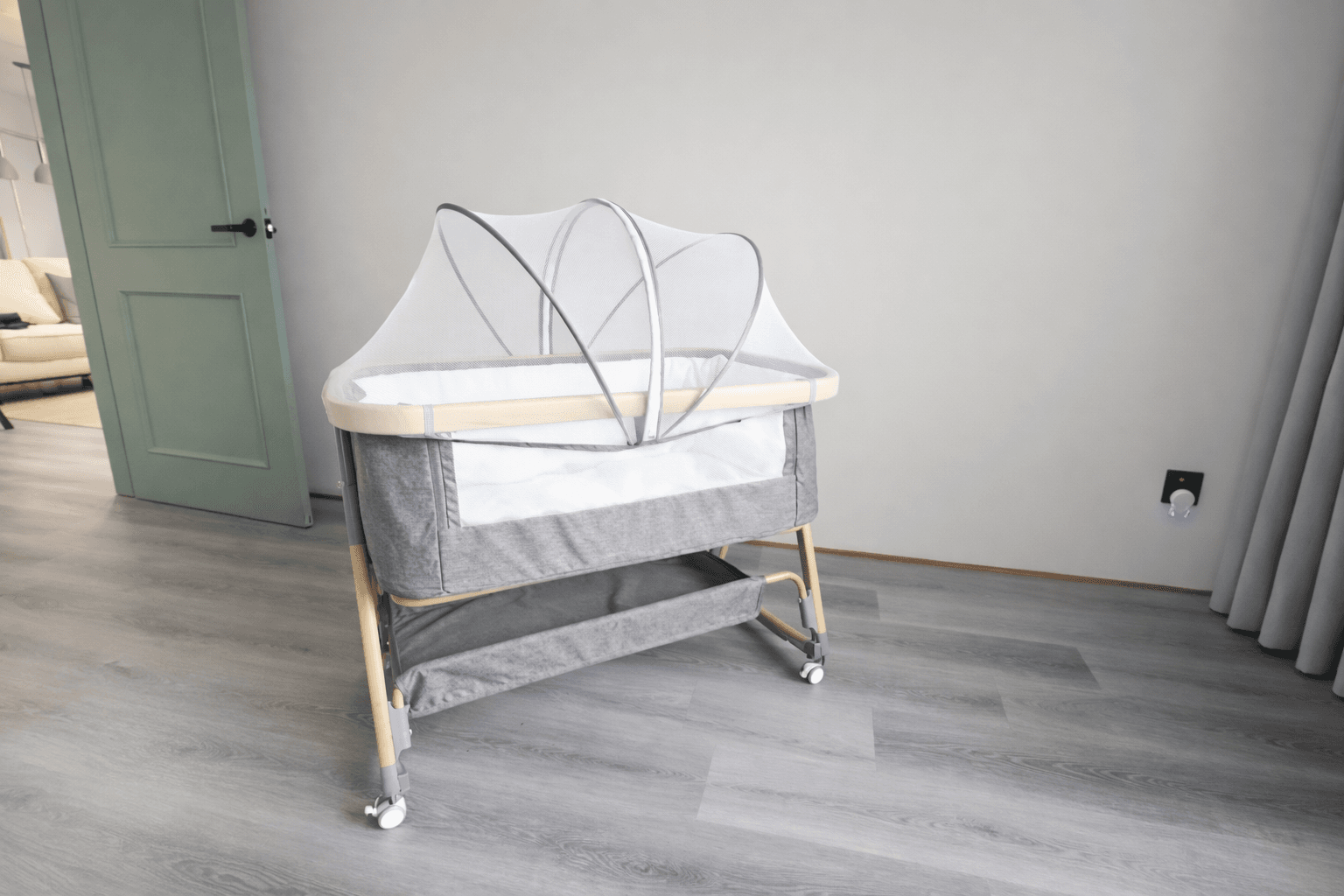 Baby cot provided on request in family-friendly Tiny Living Apartments