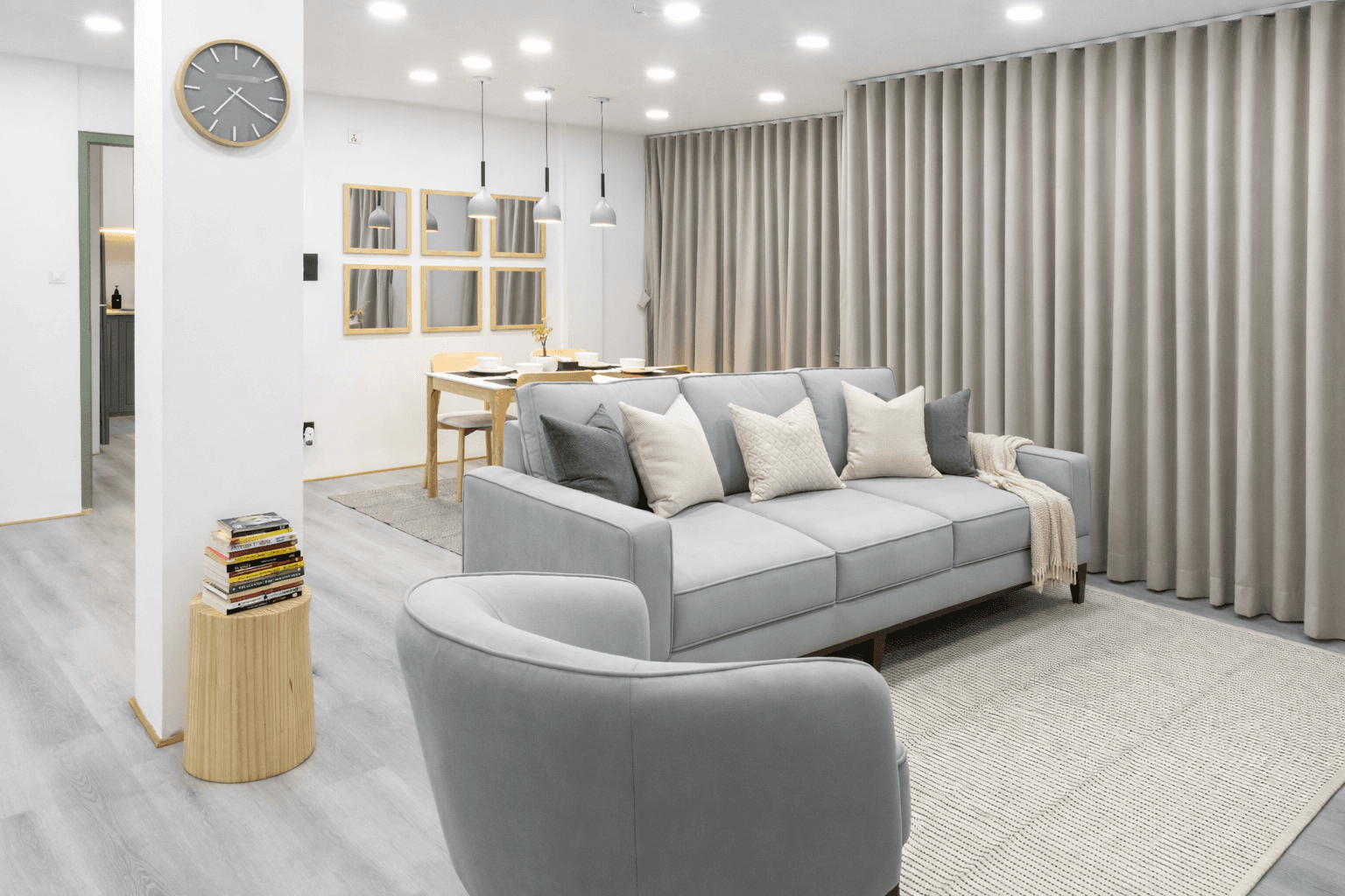 Tiny Living Apartment lounge — comfortable corner with armchair and natural light